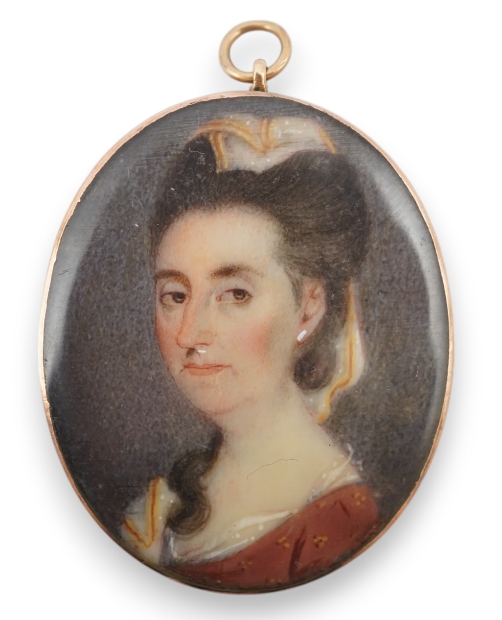 An early 19th century portrait miniature of a lady with Miers style silhouette of a gentleman verso, gold framed, 4.5cm high overall. CITES Submission reference HYCB3BFA. Condition - fair to good